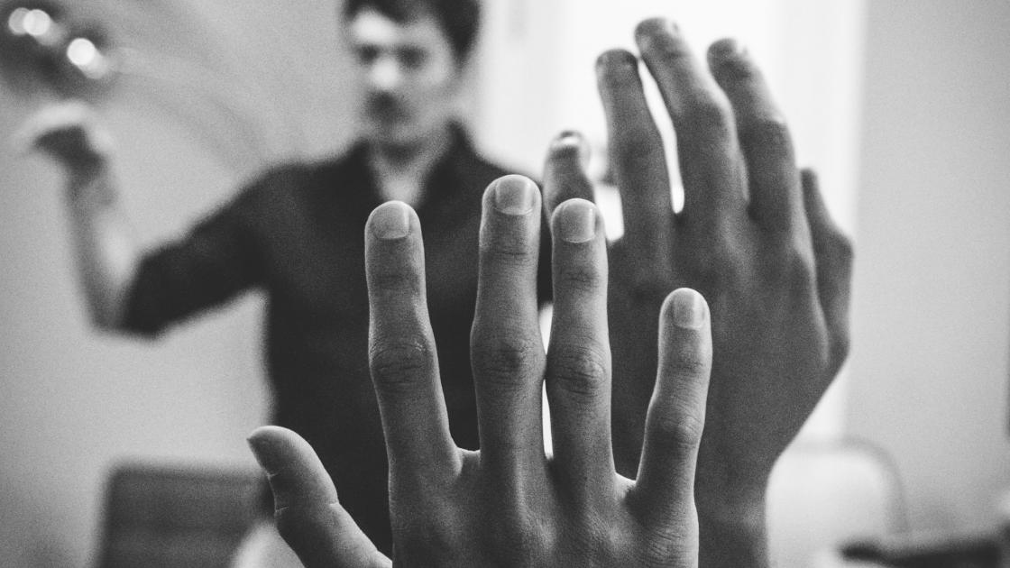 two raised hands