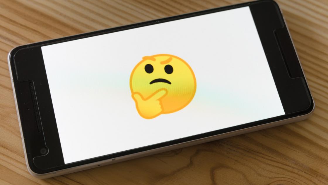 thinking emoji on a phone screen 
